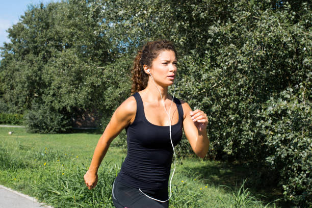 istock young attractive woman running outdoor 1051442708