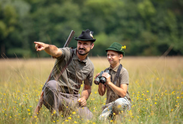 istock Ranger and his son in the woods 1051446442