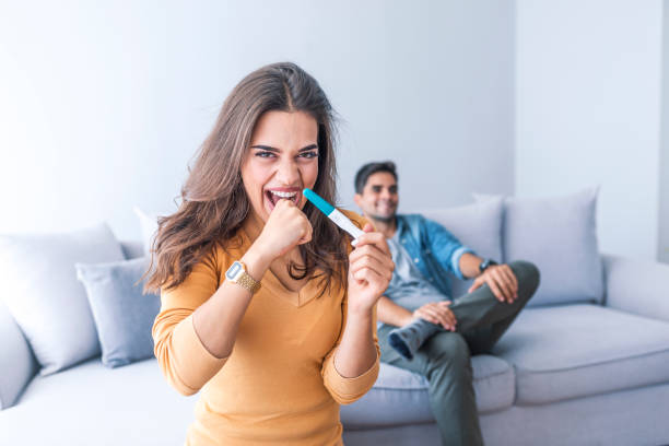 istock Celebrating Positive Home Pregnancy Test Result 1051446948