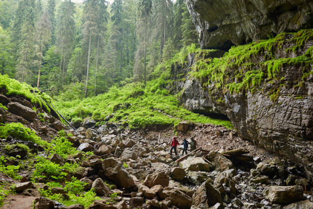 istock Hikers in a cave on a trail 1051447244