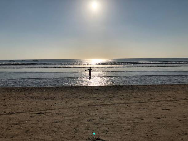woman on a tropical beach in the sunset