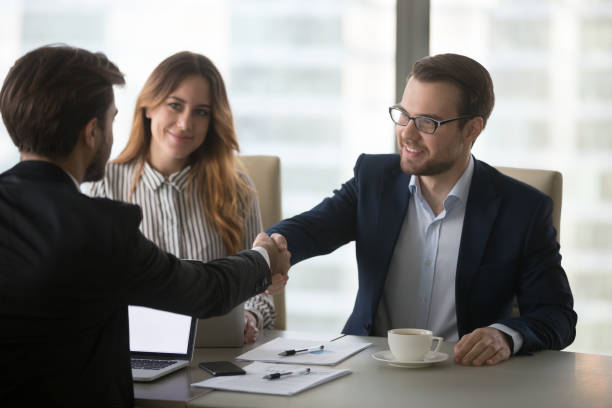 istock Business partners handshaking greeting at meeting in office 1051453364