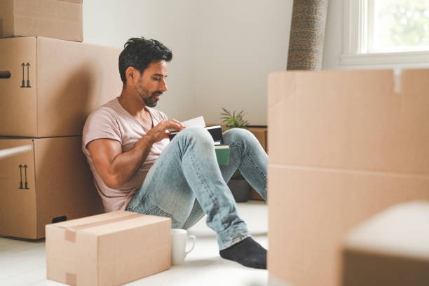 istock Man tired from moving into a new house 1051453868