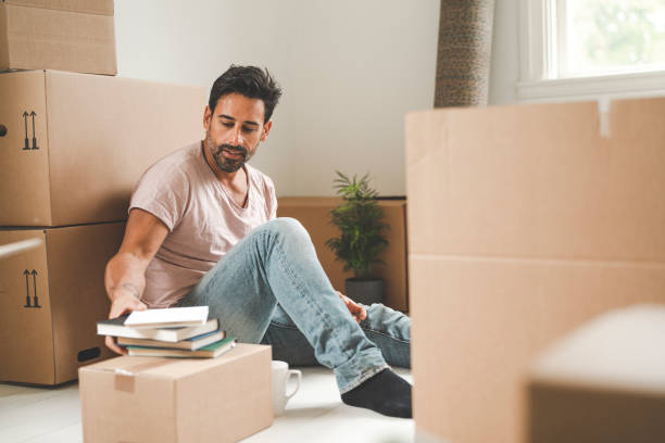 istock Man tired from moving into a new house 1051453878