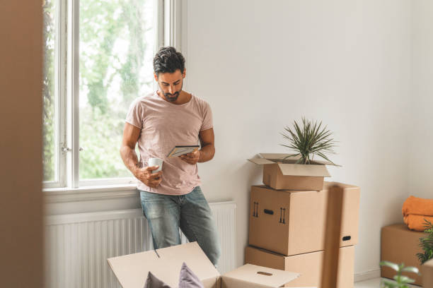 istock Man moving into a new house 1051454096