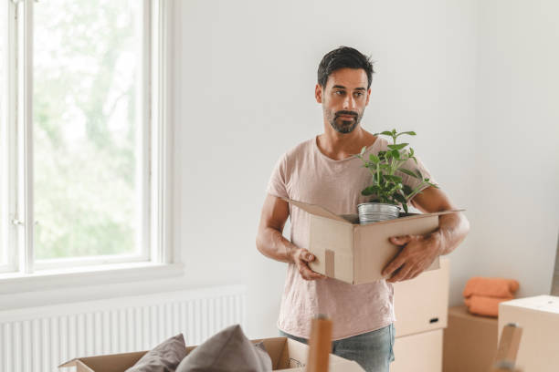 istock Man moving into a new house 1051454352