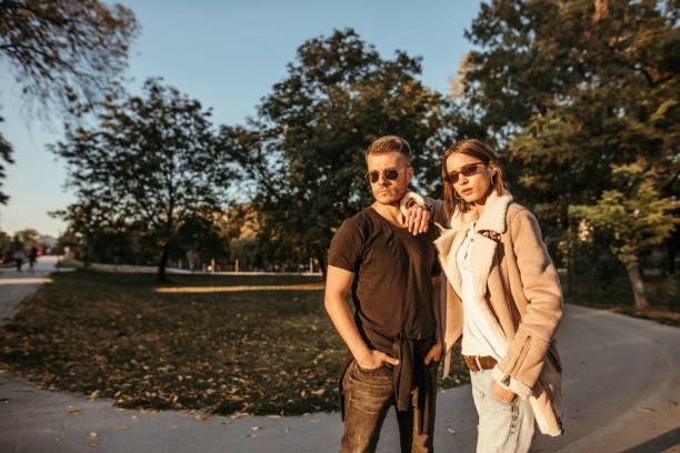 istock Young couple in park posing for photo 1051472654