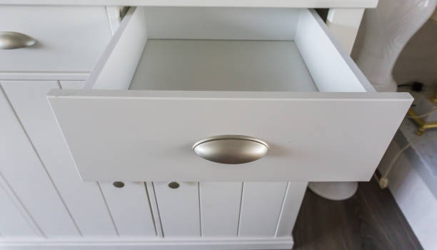 istock Empty open modern white wooden drawer with nothing inside so empty space to put whatever you like 1051487940