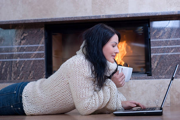 istock Woman relaxing while drink coffee and working on a laptop 105148946