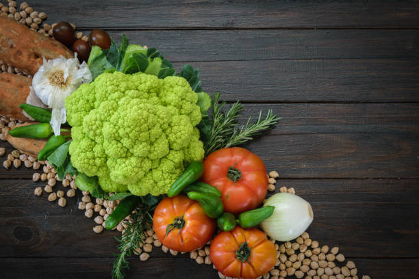 istock Colorful vegetables and chiskpeas dark background. 1051499000