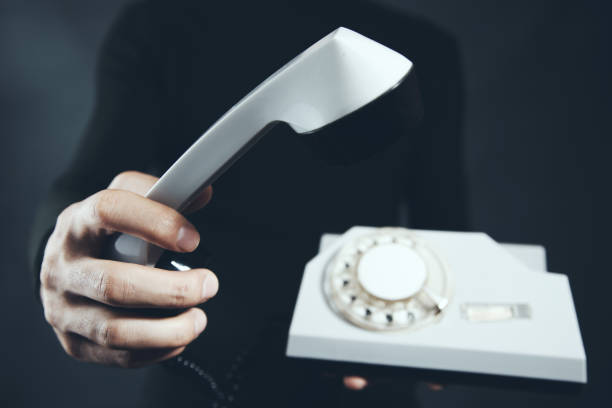 istock man hand vintage  telephone 1051499168
