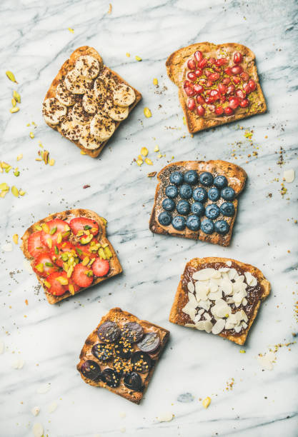 istock Vegan whole grain toasts with fruit, seeds, nuts, top view 1051525908