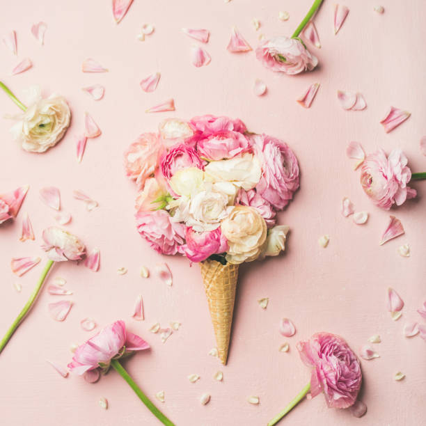 istock Waffle cone with pink and white buttercup flowers 1051525914
