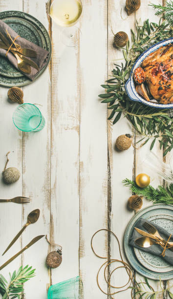 Christmas or New Year celebration table setting over wooden background
