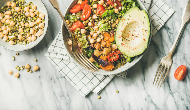 istock Vegan dinner bowl with avocado, mixed grains, beans, vegetables 1051525956