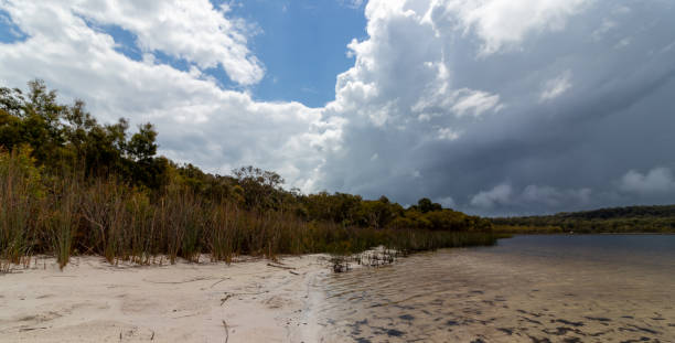 istock Low aspect view of sky over lake, sunny and cloudy 1051526672