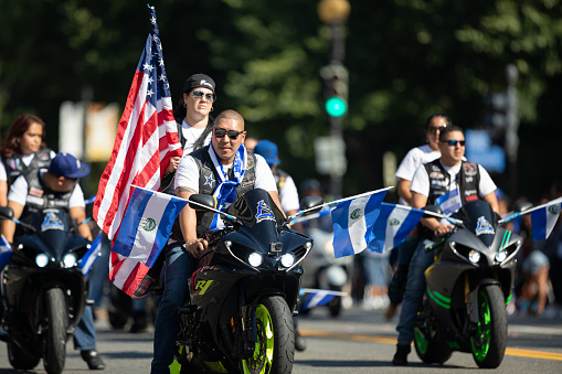 Washington, D.C., USA - September 29, 2018: The Fiesta DC Parade, Bikers from El Salvador carrying El Salvadoran Flags and the American Flag