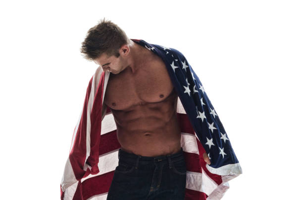 istock Attractive shirtless guy holding the American flag 1051537710