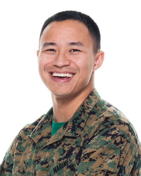 istock US Marine in uniform with arms crossed 1051538352