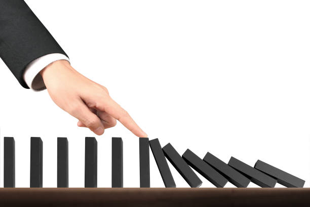 istock Hand Stopping domino concept 1051538462