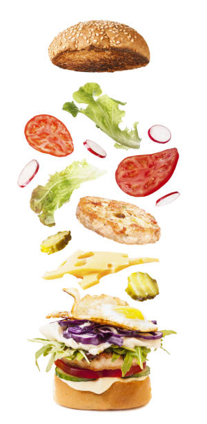 istock Big tasty burger with flying ingredients 1051541452