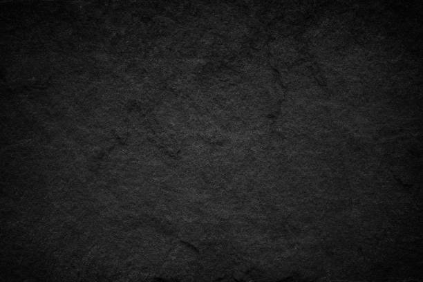 istock Dark grey black slate background or natural stone texture. 1051546498