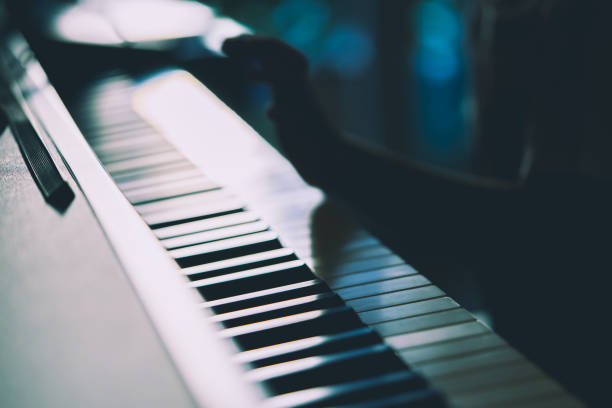 istock Little Boy hand is playing with piano 1051555782