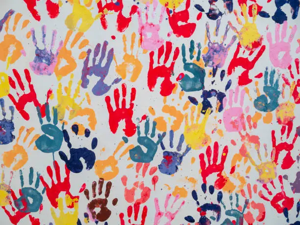 Colorful hand prints on white background