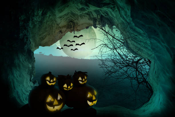 istock Halloween background. Spooky pumpkin with moon and dead trees on dark forest. Halloween design concept with copy space. 1051563570