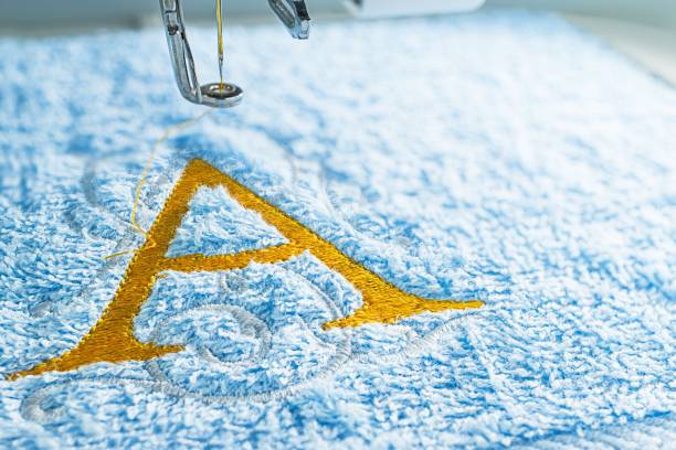 istock Embroidery machine and alphabet design close up picture 1051567958