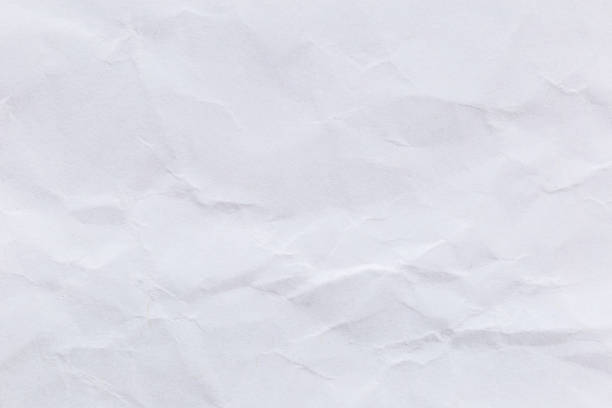 istock Crumpled white paper background for design. 1051569188