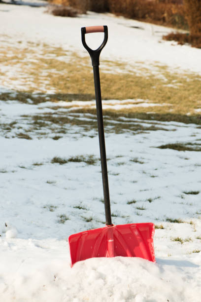 istock Red plastic shovel for snow removal. 1051571712