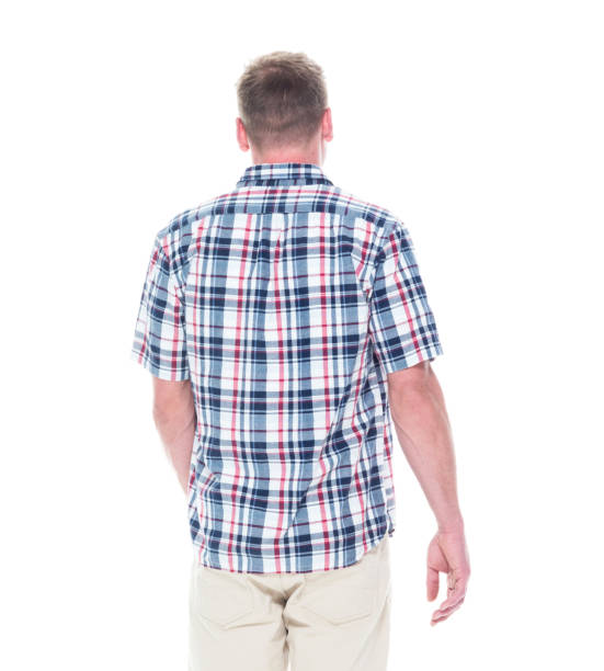 istock Handsome man in shirt and shorts with hands by side 1051578054