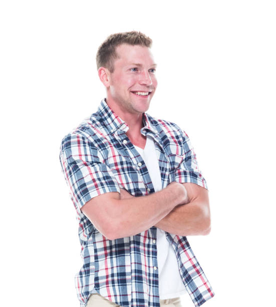 istock Handsome man in shirt and shorts with arms folded 1051578090