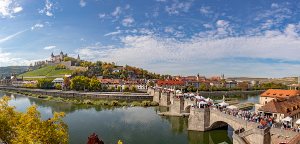 panoramic view of fortress Marienberg and old historic bridge crossing river Main in Wuerzburg, Germany