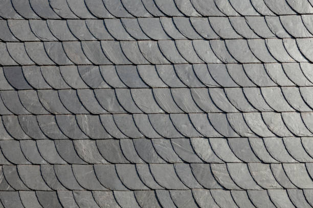 detail of slate shingle roof in grey