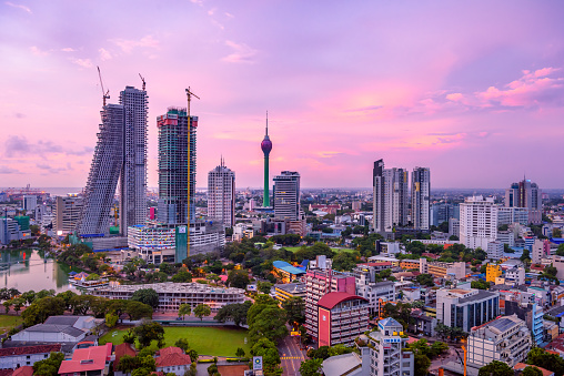 Colombo Sri Lanka skyline cityscape photo. Sunset in Colombo with views over the biggest city in Sri Lanka island. Urban views of buildings and the Laccadive Sea