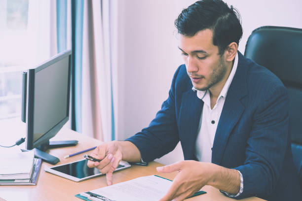 istock Business man is taking note on interview resume report 1051600158