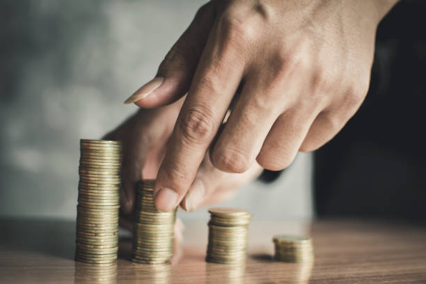 istock Hand set money on wood, Concept save money 1051605968