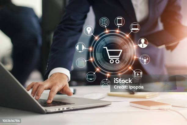 Digital Marketing Businessman Working With Laptop Computer Tablet And Smart Phone Modern Interface Payments Online Shopping And Icon Customer Network Connection On Virtual Screen Business Innovation Technology Concept Stock Photo - Download Image Now