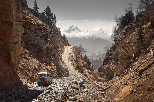 Off-road travel on extreme mountain road in Upper Mustang, Nepal. Nice view of the Himalaya Mountains