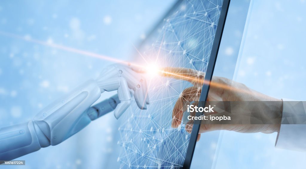 Hands of robot and human touching on global virtual network connection future interface. Artificial intelligence technology concept. Artificial Intelligence Stock Photo