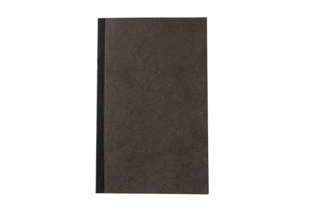 istock Black book isolated on white background, top view 1051617550
