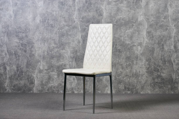 istock Leather office chair in empty room with gray texture wall background 1051620412