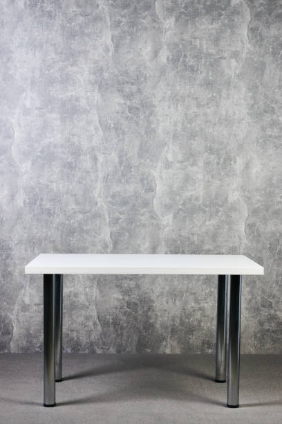 istock White wooden table with leg in office, indoor 1051620464