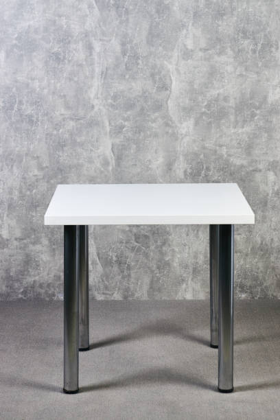 istock White wooden table with leg in office, indoor 1051620486