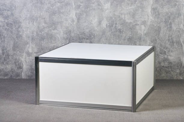 istock White showcase stand against gray textured wall background 1051620622