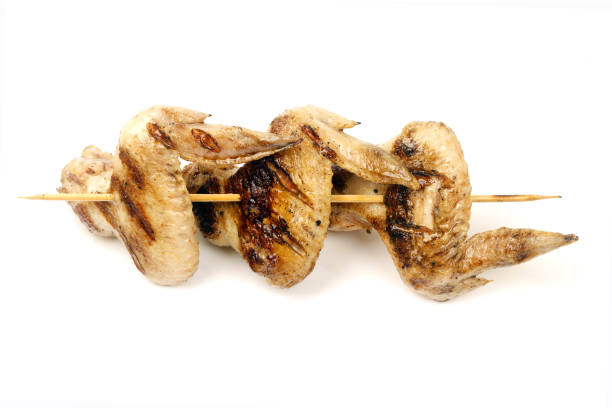 istock chicken wings fried on a grill strung on a skewer 1051623264