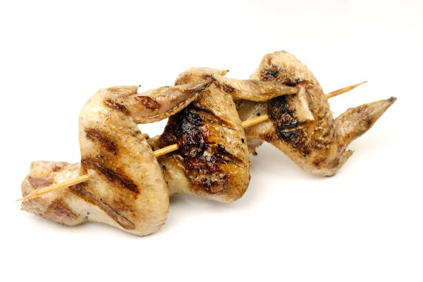 istock chicken wings fried on a grill strung on a skewer 1051623342