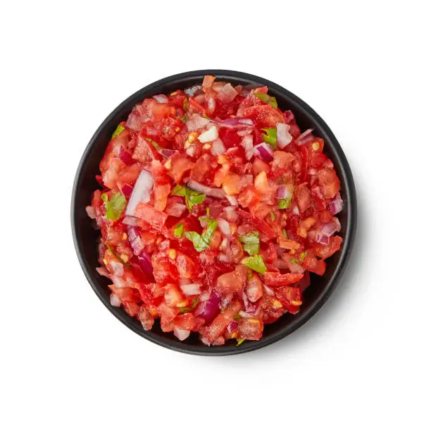 Photo of Fresh Tomato salsa isolated on white background